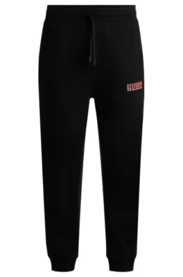 Cotton-terry tracksuit bottoms with logo print