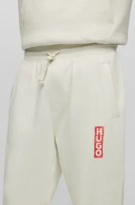 Cotton-terry tracksuit bottoms with vertical logo