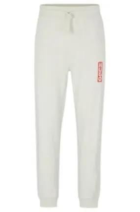 Cotton-terry tracksuit bottoms with vertical logo