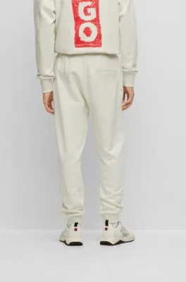 Cotton-terry tracksuit bottoms with vertical logo