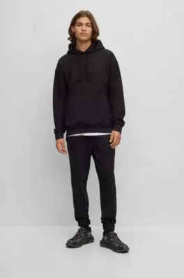 Relaxed-fit cotton-terry tracksuit bottoms with stacked logo