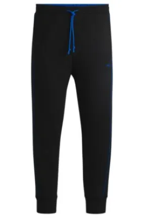 Stretch-cotton tracksuit bottoms with embossed artwork