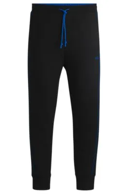 Stretch-cotton tracksuit bottoms with embossed artwork